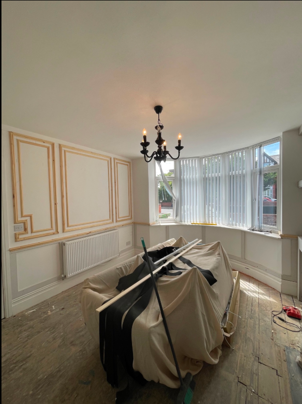 Decorative rectangular timber mouldings fitted to an interior wall