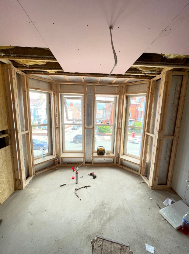 Timber stud framing forming internal walls and window openings