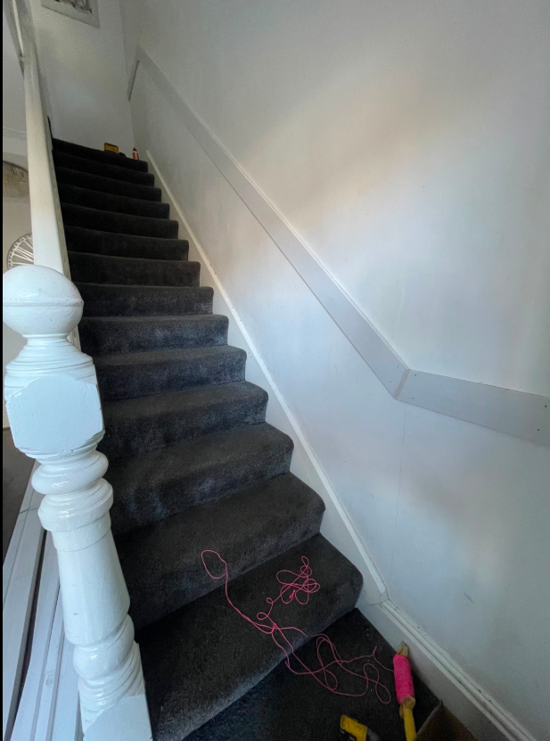 Decorative timber trim fitted along an interior staircase wall